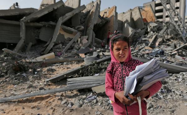 Palestinian leaders in Gaza report that they've agreed to a cease-fire with Israel to end a deadly two-day escalation of violence. Here, a Palestinian girl stands in front of a building on Monday that was destroyed during Israeli airstrikes on Gaza City o Palestinian leaders in Gaza report that they've agreed to a cease-fire with Israel to end a deadly two-day escalation of violence. Here, a Palestinian girl stands in front of a building on Monday that was destroyed during Israeli airstrikes on Gaza City o