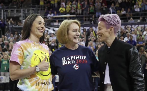 Seattle Mayor Jenny Durkan, center, wears a T-shirt honoring Megan Rapinoe, right, of the U.S. women's World Cup champion soccer team and the Seattle Storm's Sue Bird, left, before a WNBA game on July 12. Seattle Mayor Jenny Durkan, center, wears a T-shirt honoring Megan Rapinoe, right, of the U.S. women's World Cup champion soccer team and the Seattle Storm's Sue Bird, left, before a WNBA game on July 12.