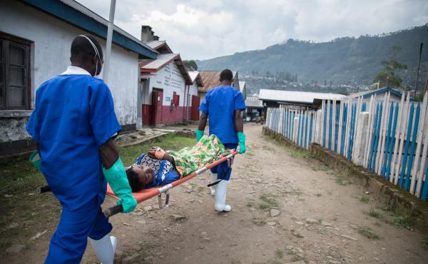 Medical workers transfer a patient from the Doctors Without Borders cholera treatment unit to the intensive care unit at the general hospital in Masisi, Democratic Republic of Congo. Medical workers transfer a patient from the Doctors Without Borders cholera treatment unit to the intensive care unit at the general hospital in Masisi, Democratic Republic of Congo.