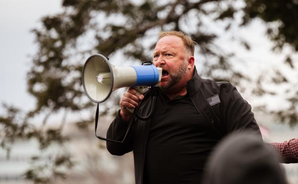 Alex Jones addresses a pro-Trump crowd on Jan. 6, the day of the U.S. Capitol riot. Jones is widely known for his support of baseless and often bigoted conspiracy theories, and he has been banned from many tech platforms, though not Amazon. Alex Jones addresses a pro-Trump crowd on Jan. 6, the day of the U.S. Capitol riot. Jones is widely known for his support of baseless and often bigoted conspiracy theories, and he has been banned from many tech platforms, though not Amazon.