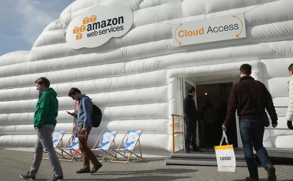 Visitors arrive at the cloud pavilion of Amazon Web Services at the 2016 CeBIT digital technology trade fair on March 14, 2016 in Hanover, Germany. Visitors arrive at the cloud pavilion of Amazon Web Services at the 2016 CeBIT digital technology trade fair on March 14, 2016 in Hanover, Germany.