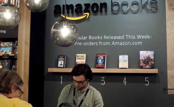 A clerk works the counter at Amazon Books, the retailer's first brick-and-mortar store that opened in Seattle Tuesday. A clerk works the counter at Amazon Books, the retailer's first brick-and-mortar store that opened in Seattle Tuesday.