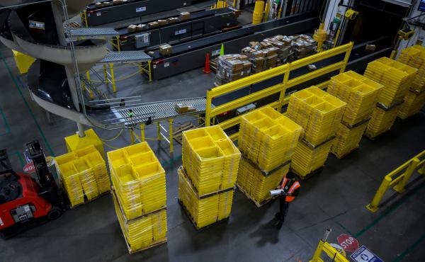 A man works at an Amazon fulfillment center in Staten Island, New York. The retail giant faces a major labor battle with a unionization vote planned at a similar warehouse in Alabama. A man works at an Amazon fulfillment center in Staten Island, New York. The retail giant faces a major labor battle with a unionization vote planned at a similar warehouse in Alabama.