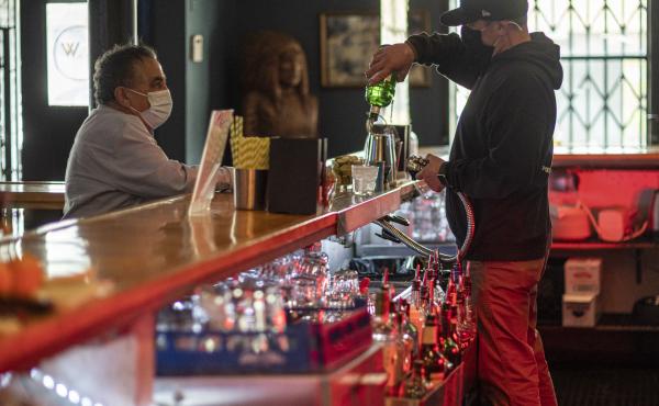 A bartender mixes a drink inside a bar last week in San Francisco. The latest retail sales data out on Friday showed an increase in sales at restaurants and bars as more people venture out amid the continued reopening of the U.S. economy. A bartender mixes a drink inside a bar last week in San Francisco. The latest retail sales data out on Friday showed an increase in sales at restaurants and bars as more people venture out amid the continued reopening of the U.S. economy.
