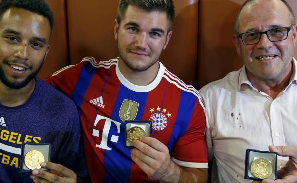 Three men who helped to disarm an attacker on a train from Amsterdam to France, from left to right, Anthony Sadler, Alek Skarlatos and Chris Norman, a British man living in France, pose with medals they received for their bravery at a restaurant in Arras, Three men who helped to disarm an attacker on a train from Amsterdam to France, from left to right, Anthony Sadler, Alek Skarlatos and Chris Norman, a British man living in France, pose with medals they received for their bravery at a restaurant in Arras,