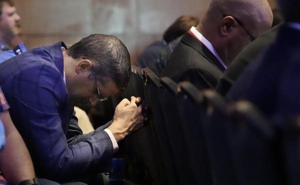 A man prays during the executive committee plenary meeting at the Southern Baptist Convention's annual gathering Monday in Nashville, Tenn. A man prays during the executive committee plenary meeting at the Southern Baptist Convention's annual gathering Monday in Nashville, Tenn.