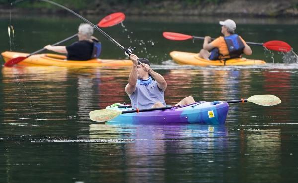 A fisherman in a kayak makes a cast on Lake Arthur at Moraine State Park in Portersville, Pa. Sales of camping, outdoor and recreational equipment have been surging. A fisherman in a kayak makes a cast on Lake Arthur at Moraine State Park in Portersville, Pa. Sales of camping, outdoor and recreational equipment have been surging.