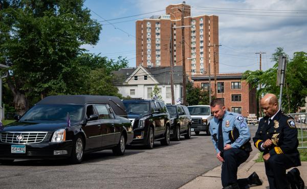 Minneapolis Police Chief Medaria Arradondo (right) kneels as the hearse of George Floyd arrives to North Central University ahead of funeral service on Thursday. Protests in the wake of Floyd's death while in police custody has erupted across the country. Minneapolis Police Chief Medaria Arradondo (right) kneels as the hearse of George Floyd arrives to North Central University ahead of funeral service on Thursday. Protests in the wake of Floyd's death while in police custody has erupted across the country.