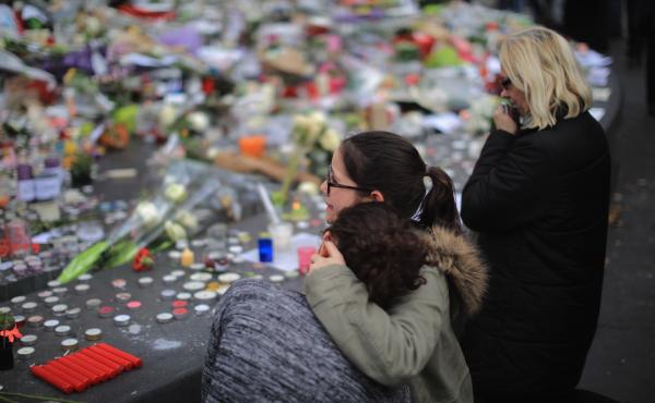 People weep as they gather Monday at the Place de la Republique to observe a minute of silence in memory of the victims of the Paris terror attacks. People weep as they gather Monday at the Place de la Republique to observe a minute of silence in memory of the victims of the Paris terror attacks.
