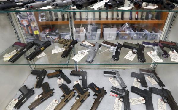 The FBI has reported a surge in background checks for gun sales. Here, firearms are for sale at a shop in New Castle, Pa. The FBI has reported a surge in background checks for gun sales. Here, firearms are for sale at a shop in New Castle, Pa.