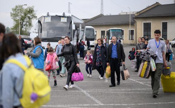 Refugees from war-torn regions of Ukraine board a coach to Warsaw at a coach station on Saturday in Lviv, Ukraine. A U.N. agency estimates that nearly 5 million jobs have been lost in Ukraine since Russia first invaded in late February. Refugees from war-torn regions of Ukraine board a coach to Warsaw at a coach station on Saturday in Lviv, Ukraine. A U.N. agency estimates that nearly 5 million jobs have been lost in Ukraine since Russia first invaded in late February.