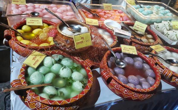 Rosogolla, also known as rasgulla, is a simple white spongy ball, made of chhena, an Indian version of cottage cheese, dunked in syrup. Above, newer, colorful iterations of this classic sweet are for sale during Rosogolla Day in Kolkata, India. Rosogolla, also known as rasgulla, is a simple white spongy ball, made of chhena, an Indian version of cottage cheese, dunked in syrup. Above, newer, colorful iterations of this classic sweet are for sale during Rosogolla Day in Kolkata, India.