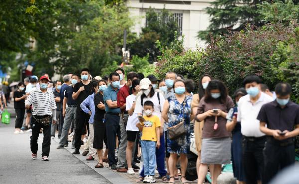 People line up for coronavirus testing on Thursday in Nanjing, in China's Jiangsu province. People line up for coronavirus testing on Thursday in Nanjing, in China's Jiangsu province.