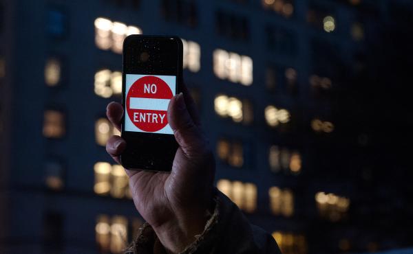 A protester supporting Apple in its battle against the FBI holds up an iPhone that reads "No Entry" outside an Apple store in New York on Feb. 23. A protester supporting Apple in its battle against the FBI holds up an iPhone that reads "No Entry" outside an Apple store in New York on Feb. 23.