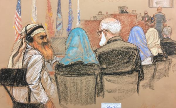Alleged Sept. 11 mastermind Khalid Sheikh Mohammed (far left) consults with his defense attorneys in the U.S. military courtroom in Guantánamo Bay, Cuba, as a man who waterboarded him, retired Air Force psychologist James Mitchell, takes the stand. Alleged Sept. 11 mastermind Khalid Sheikh Mohammed (far left) consults with his defense attorneys in the U.S. military courtroom in Guantánamo Bay, Cuba, as a man who waterboarded him, retired Air Force psychologist James Mitchell, takes the stand.