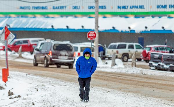A man wears a mask as the territory of Nunavut enters a two week mandatory restriction period in Iqaluit, Nunavut, Canada, on Wednesday. More than 80 COVID-19 cases have been identified this month in Nunavut, where around 39,000 people, predominantly Inui A man wears a mask as the territory of Nunavut enters a two week mandatory restriction period in Iqaluit, Nunavut, Canada, on Wednesday. More than 80 COVID-19 cases have been identified this month in Nunavut, where around 39,000 people, predominantly Inui