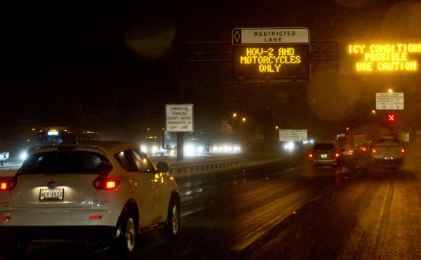 Signs warn drivers of icy road conditions on Interstate 66 in Fairfax County, Va., in March 2014. The state's Department of Transportation recently added rush hour tolls to the road, using dynamic pricing, which continuously adjusts the cost based on cong Signs warn drivers of icy road conditions on Interstate 66 in Fairfax County, Va., in March 2014. The state's Department of Transportation recently added rush hour tolls to the road, using dynamic pricing, which continuously adjusts the cost based on cong