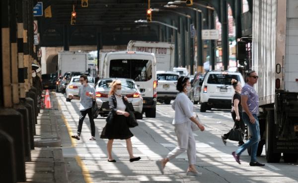 People walk along a main street in Brighton Beach, Brooklyn on Thursday in New York City. People walk along a main street in Brighton Beach, Brooklyn on Thursday in New York City.