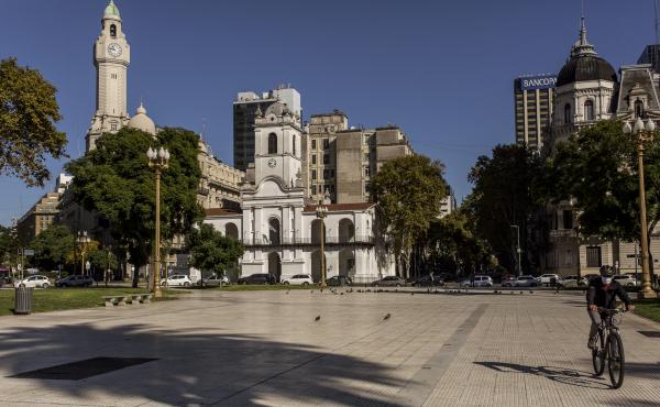 A cyclist crosses Plaza de Mayo in the center of Buenos Aires on April 30. Argentina is loosening its strict lockdown but keeping most restrictions in the capital in place. A cyclist crosses Plaza de Mayo in the center of Buenos Aires on April 30. Argentina is loosening its strict lockdown but keeping most restrictions in the capital in place.