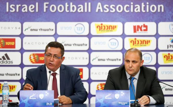 Ofer Eini and Rotem Kamer, president and CEO of the Israeli Football Association, respectively, address the media Wednesday in the town of Ramat Gan, east of Tel Aviv. The men announced that the organization will file a formal complaint to FIFA against th Ofer Eini and Rotem Kamer, president and CEO of the Israeli Football Association, respectively, address the media Wednesday in the town of Ramat Gan, east of Tel Aviv. The men announced that the organization will file a formal complaint to FIFA against th