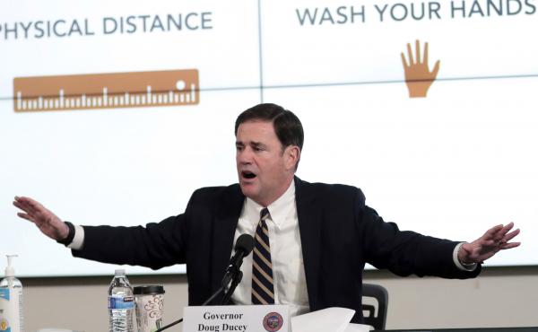 Arizona Gov. Doug Ducey updates reporters on the coronavirus pandemic during a news conference in Phoenix on Monday. Arizona Gov. Doug Ducey updates reporters on the coronavirus pandemic during a news conference in Phoenix on Monday.
