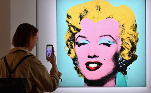 A woman takes a photo of Andy Warhol's 'Shot Sage Blue Marilyn' on April 29 during Christie's 20th and 21st Century Art press preview in New York City. A woman takes a photo of Andy Warhol's 'Shot Sage Blue Marilyn' on April 29 during Christie's 20th and 21st Century Art press preview in New York City.