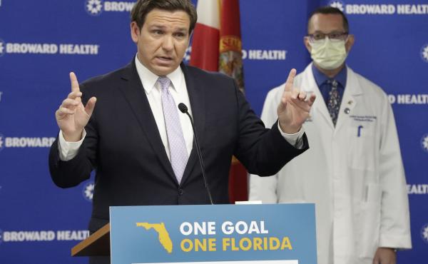 Florida Gov. Ron DeSantis, left, speaks during a news conference along with Dr. Joshua Lenchus, chief medical officer of Broward Health Medical Center on Monday. The number of patients in Florida hospitals for COVID-19 was relatively stable, at just below Florida Gov. Ron DeSantis, left, speaks during a news conference along with Dr. Joshua Lenchus, chief medical officer of Broward Health Medical Center on Monday. The number of patients in Florida hospitals for COVID-19 was relatively stable, at just below