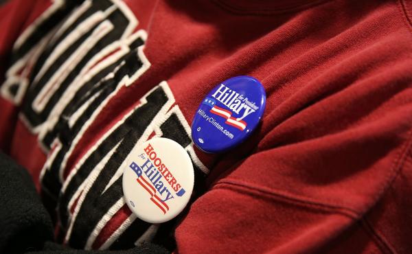 A supporter of Democratic presidential candidate Hillary Clinton wears campaign buttons as she listens to former President Bill Clinton at an event in Indiana. A supporter of Democratic presidential candidate Hillary Clinton wears campaign buttons as she listens to former President Bill Clinton at an event in Indiana.