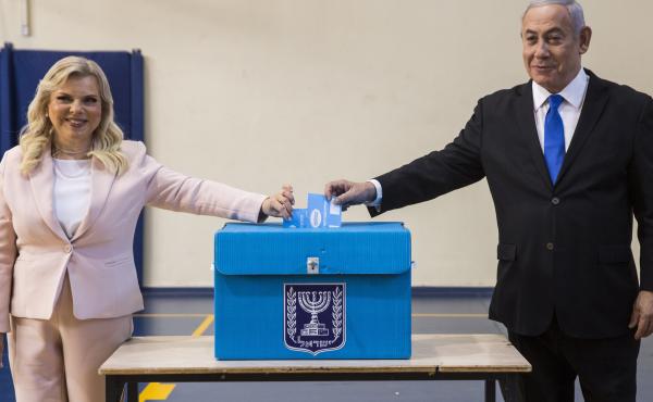 Israeli Prime Minister Benjamin Netanyahu and his wife, Sara, cast their votes at a voting station in Jerusalem on Tuesday. Israeli Prime Minister Benjamin Netanyahu and his wife, Sara, cast their votes at a voting station in Jerusalem on Tuesday.