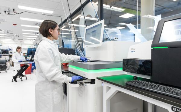 An employee of the Boston biotech company Ginkgo Bioworks runs a gene sequencing machine through its paces. The company synthesizes thousands of genes a month, which are then inserted into cells that become mini factories of useful products. An employee of the Boston biotech company Ginkgo Bioworks runs a gene sequencing machine through its paces. The company synthesizes thousands of genes a month, which are then inserted into cells that become mini factories of useful products.