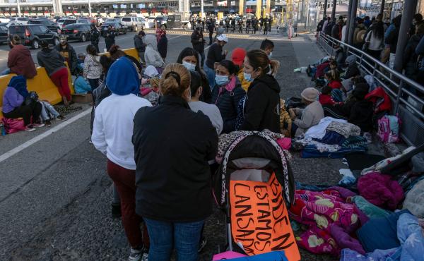 Migrants and asylum seekers are seen after spending the night in one of the car lanes off the San Ysidro Crossing Port on the Mexican side of the U.S.-Mexico border in Tijuana on April 24, 2021. A group of migrants asked U.S. migration authorities to allo Migrants and asylum seekers are seen after spending the night in one of the car lanes off the San Ysidro Crossing Port on the Mexican side of the U.S.-Mexico border in Tijuana on April 24, 2021. A group of migrants asked U.S. migration authorities to allo