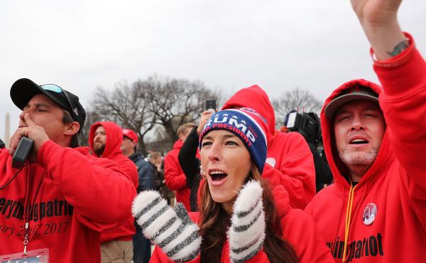 Supporters react on the National Mall to the inauguration of Donald Trump on January 20, 2017 in Washington, DC. Supporters react on the National Mall to the inauguration of Donald Trump on January 20, 2017 in Washington, DC.