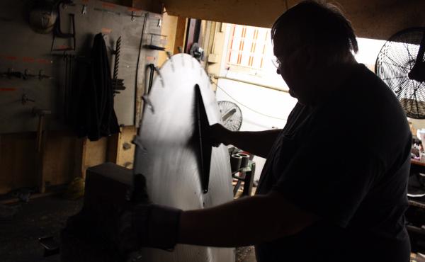 A worker checks a finished saw blade at the Simonds International plant. The plant employs 80 people and may suffer under President Trump's proposed tariffs on imported steel. A worker checks a finished saw blade at the Simonds International plant. The plant employs 80 people and may suffer under President Trump's proposed tariffs on imported steel.
