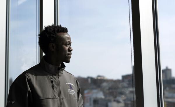 Allan Monga, a Deering High School junior, won Poetry Out Loud contests at school and at the state level. He was initially denied entry to the national competition because he's an asylum seeker and not a U.S. citizen. Allan Monga, a Deering High School junior, won Poetry Out Loud contests at school and at the state level. He was initially denied entry to the national competition because he's an asylum seeker and not a U.S. citizen.
