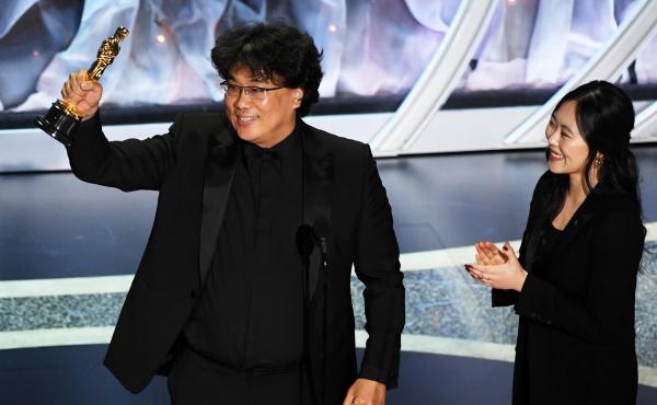 Bong Joon-ho, here with interpreter Sharon Choi, won big at Sunday's Oscars. His film Parasite took best international feature and best picture, and he was recognized for his direction and writing. Bong Joon-ho, here with interpreter Sharon Choi, won big at Sunday's Oscars. His film Parasite took best international feature and best picture, and he was recognized for his direction and writing.