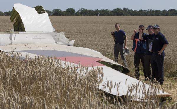 Australian and Dutch investigators examine a piece of the downed Malaysia Airlines Flight 17 plane, in eastern Ukraine's Donetsk region in August 2014. Australian and Dutch investigators examine a piece of the downed Malaysia Airlines Flight 17 plane, in eastern Ukraine's Donetsk region in August 2014.