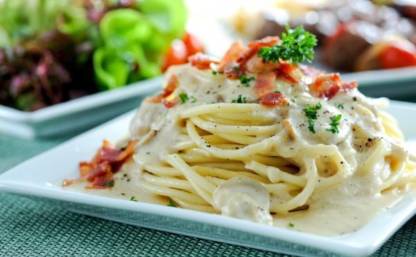 Pasta Carbonara is made with spaghetti, eggs, cheese and pork. Pasta Carbonara is made with spaghetti, eggs, cheese and pork.