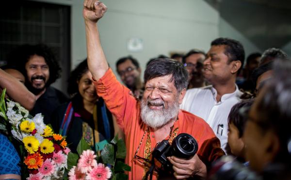 Bangladeshi photographer and activist Shahidul Alam, center, reacts as he is released from Dhaka Central Jail, Keraniganj, near Dhaka on Tuesday. Bangladeshi photographer and activist Shahidul Alam, center, reacts as he is released from Dhaka Central Jail, Keraniganj, near Dhaka on Tuesday.