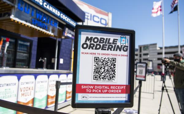 A mobile ordering sign is seen on March 30 at a vending station in Nationals Park, home of the Washington Nationals. The Nats, along with many other teams in baseball, are implementing new safety protocols, including for ordering food, as a new season kic A mobile ordering sign is seen on March 30 at a vending station in Nationals Park, home of the Washington Nationals. The Nats, along with many other teams in baseball, are implementing new safety protocols, including for ordering food, as a new season kic