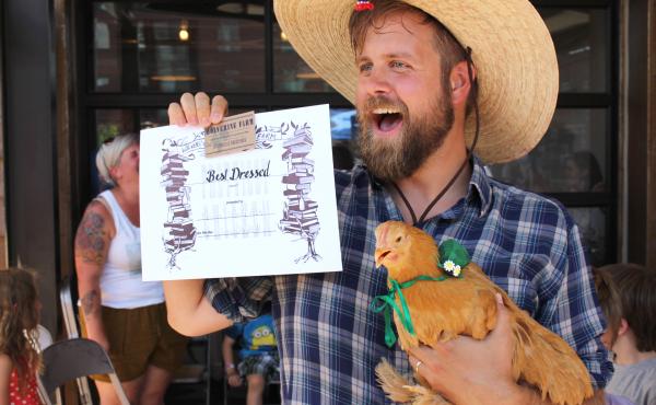 Cale Whicker, with Miss Felicia Fancy Feet, displays their award for the competition's best-dressed chicken. Cale Whicker, with Miss Felicia Fancy Feet, displays their award for the competition's best-dressed chicken.