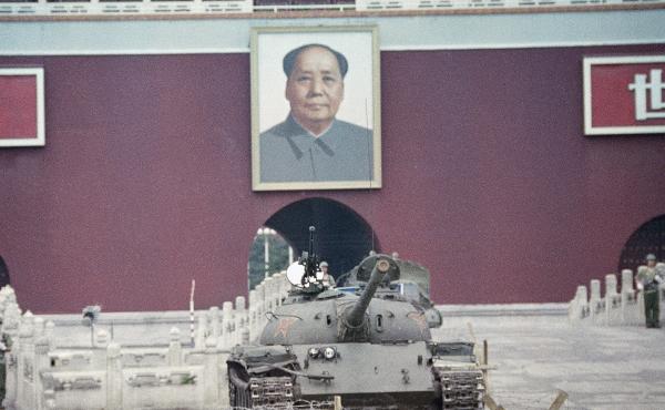 A People's Liberation Army tank sits below a portrait of Mao Zedong at the Gate of Heavenly Peace in Beijing on June 11, 1989, one week after the crackdown on protesters at Tiananmen Square. A People's Liberation Army tank sits below a portrait of Mao Zedong at the Gate of Heavenly Peace in Beijing on June 11, 1989, one week after the crackdown on protesters at Tiananmen Square.
