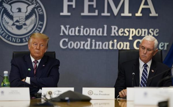 President Donald Trump and Vice President Mike Pence listen during a Hurricane Laura briefing at FEMA headquarters in Washington. President Donald Trump and Vice President Mike Pence listen during a Hurricane Laura briefing at FEMA headquarters in Washington.