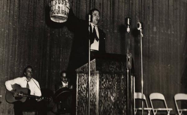 "Big Jim" Folsom during a campaign event in 1946. He also would bring a bucket and mop to campaign events, vowing to clean up state government. The bucket was used to collect campaign donations. "Big Jim" Folsom during a campaign event in 1946. He also would bring a bucket and mop to campaign events, vowing to clean up state government. The bucket was used to collect campaign donations.