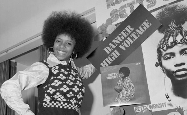 Betty Wright in 1975, when she was 21 years old, stands with a display of some of her album covers. Wright was already a veteran by the time she was out of her teens, having released four studio albums that included multiple songs that would be career sig Betty Wright in 1975, when she was 21 years old, stands with a display of some of her album covers. Wright was already a veteran by the time she was out of her teens, having released four studio albums that included multiple songs that would be career sig