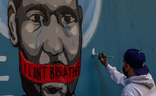 The artist Celos paints a mural in downtown Los Angeles on May 30, 2020 in protest against the killing of George Floyd by police in Minneapolis. The artist Celos paints a mural in downtown Los Angeles on May 30, 2020 in protest against the killing of George Floyd by police in Minneapolis.
