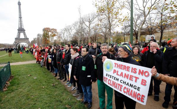 President Joe Biden is directing the U.S. to rejoin the international Paris Climate Agreement, which aims to cut global greenhouse gas emissions. Here, activists rally on Dec. 12, 2015. President Joe Biden is directing the U.S. to rejoin the international Paris Climate Agreement, which aims to cut global greenhouse gas emissions. Here, activists rally on Dec. 12, 2015.