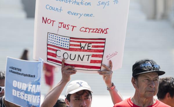 Protesters hold signs about the 2020 census in front of the U.S. Supreme Court in 2019. President-elect Joe Biden is set to reverse the Trump administration's policy of excluding unauthorized immigrants from population numbers used to reallocate congressi Protesters hold signs about the 2020 census in front of the U.S. Supreme Court in 2019. President-elect Joe Biden is set to reverse the Trump administration's policy of excluding unauthorized immigrants from population numbers used to reallocate congressi