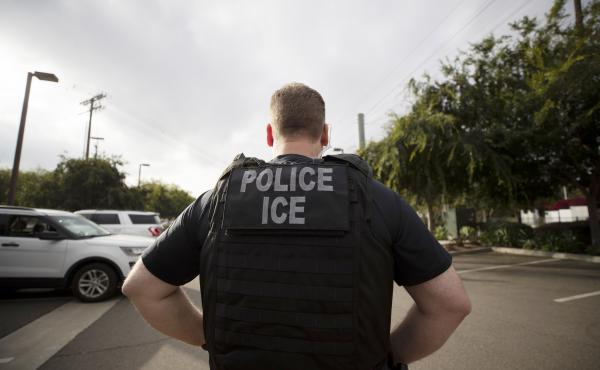 A U.S. Immigration and Customs Enforcement officer looks on during an operation in Escondido, Calif., in 2019. The Biden administration today announced new guidelines that are expected to sharply limit arrests and deportations carried out by ICE. A U.S. Immigration and Customs Enforcement officer looks on during an operation in Escondido, Calif., in 2019. The Biden administration today announced new guidelines that are expected to sharply limit arrests and deportations carried out by ICE.