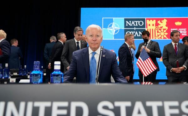 President Biden waits for the start of a roundtable meeting at the NATO summit in Madrid. He announced the U.S. would increase its military presence in Europe. President Biden waits for the start of a roundtable meeting at the NATO summit in Madrid. He announced the U.S. would increase its military presence in Europe.