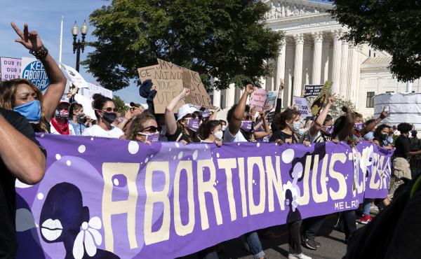 Thousands of demonstrators march outside the U.S. Supreme Court during the Women's March in Washington, Saturday, Oct. 2, 2021. Thousands of demonstrators march outside the U.S. Supreme Court during the Women's March in Washington, Saturday, Oct. 2, 2021.